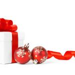 Colorful red gifts with Christmas balls isolated on white